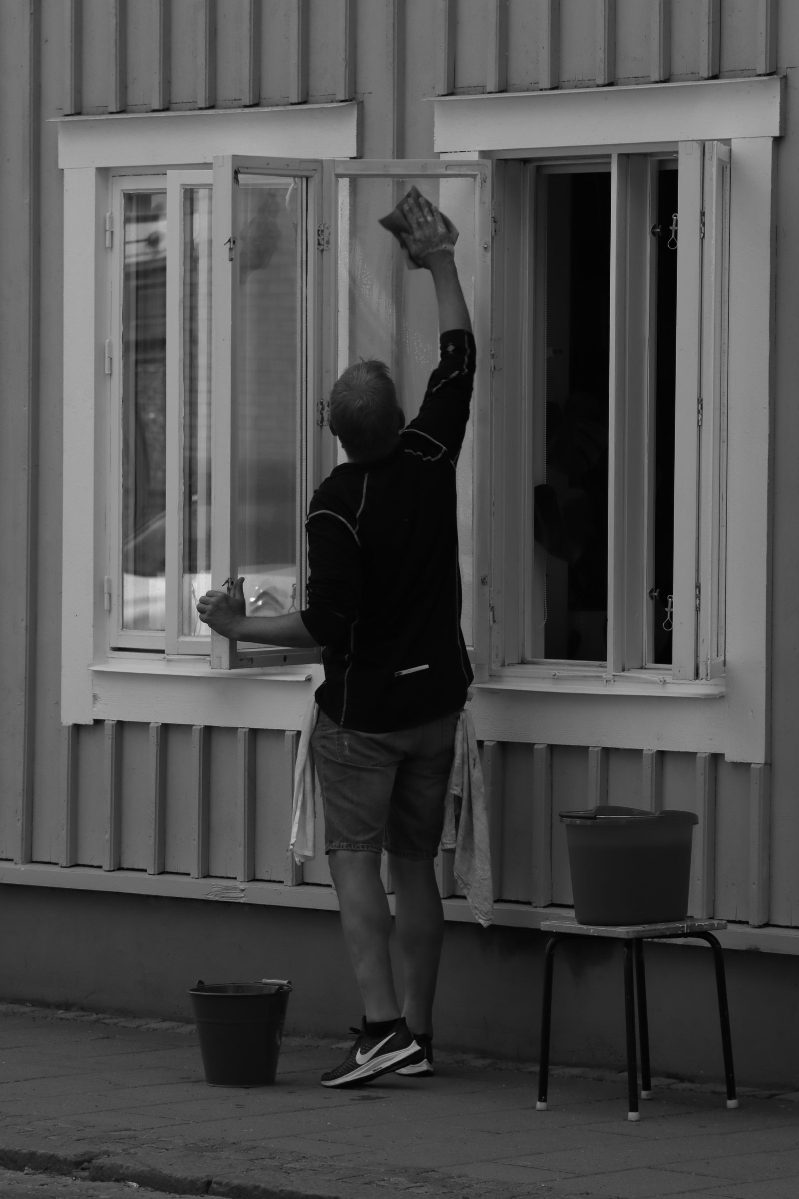 Window cleaner working on a city building
